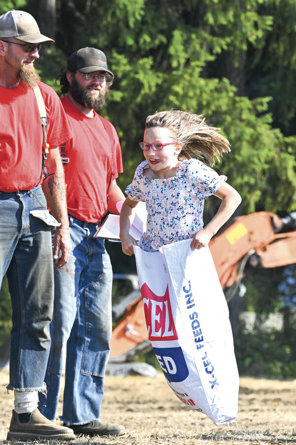 Lola, 9, lays it down in the sack race during the Peninsula Logging Show & Festival Aug. 19.